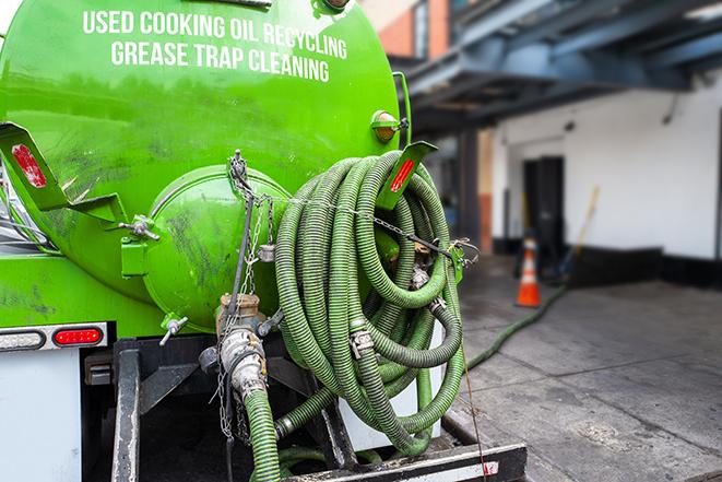 maintenance crew pumping grease trap at a fast food restaurant in Bridgewater